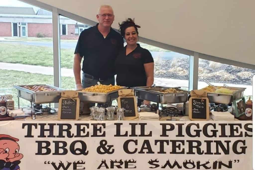 Patrick and Lori Barbee, owners of Three Little Piggies BBQ, catering an event